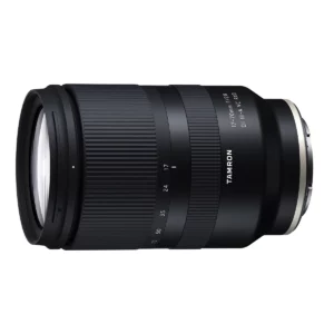 Tamron B070S | 17-70mm F/2.8 Di III-A VC RXD Lens | Sony EThe Tamron 17-70mm f/2.8 Di III-A VC RDX is a 25.5-105mm-equivalent lens for APS-C-format Sony E-mount mirrorless cameras. The wide to the short-tele range is ideal for everyday shooting and the fast f/2.8 constant maximum aperture suits working in difficult lighting conditions and offers improved control over depth of field. Complementing this design is a series of specialized optics, including aspherical and low dispersion elements, that produce well-corrected imagery with high sharpness, clarity, and color accuracy. Also benefitting handling, an RXD stepping motor enables quick, near-silent autofocus performance along with full-time manual focus override and a minimum focusing distance of 7.5". Suiting this lens's use in inclement weather conditions, it also features a moisture-resistant construction along with a fluorine-coated front element to protect against fingerprints and smudging. Bright constant f/2.8 maximum aperture affords consistent brightness throughout the zoom range and offers improved control over the depth of field. Two LD (Low Dispersion) elements greatly reduce color fringing and chromatic aberrations throughout the zoom range in order to realize improved clarity and color accuracy. RXD (Rapid eXtra-silent stepping Drive) autofocus motor delivers impressively quiet, quick, and smooth focusing performance to suit both stills and video applications. This focusing system also offers a minimum focusing distance of just 7.5" and a 1:4.8 maximum magnification for working with close-up subjects. Full-time manual focus override is also possible, and it is compatible with Sony's Direct Manual Focus function or fine-tuned manual control. A moisture-resistant construction benefits this lens' use in inclement conditions and a fluorine coating has also been applied to the front lens element to protect against dust, dirt, and smearing.